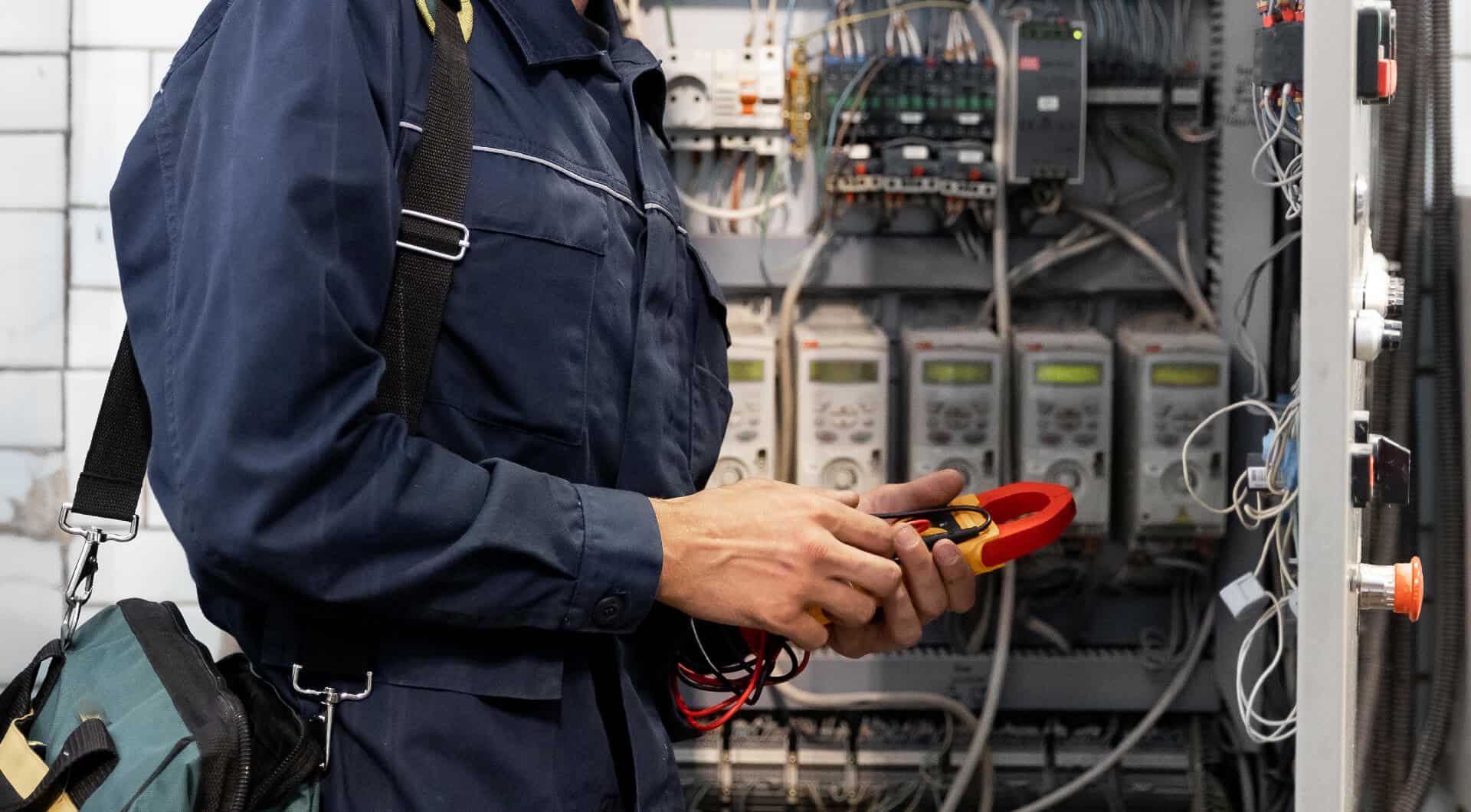 ProElec electrician testing a consumer unit